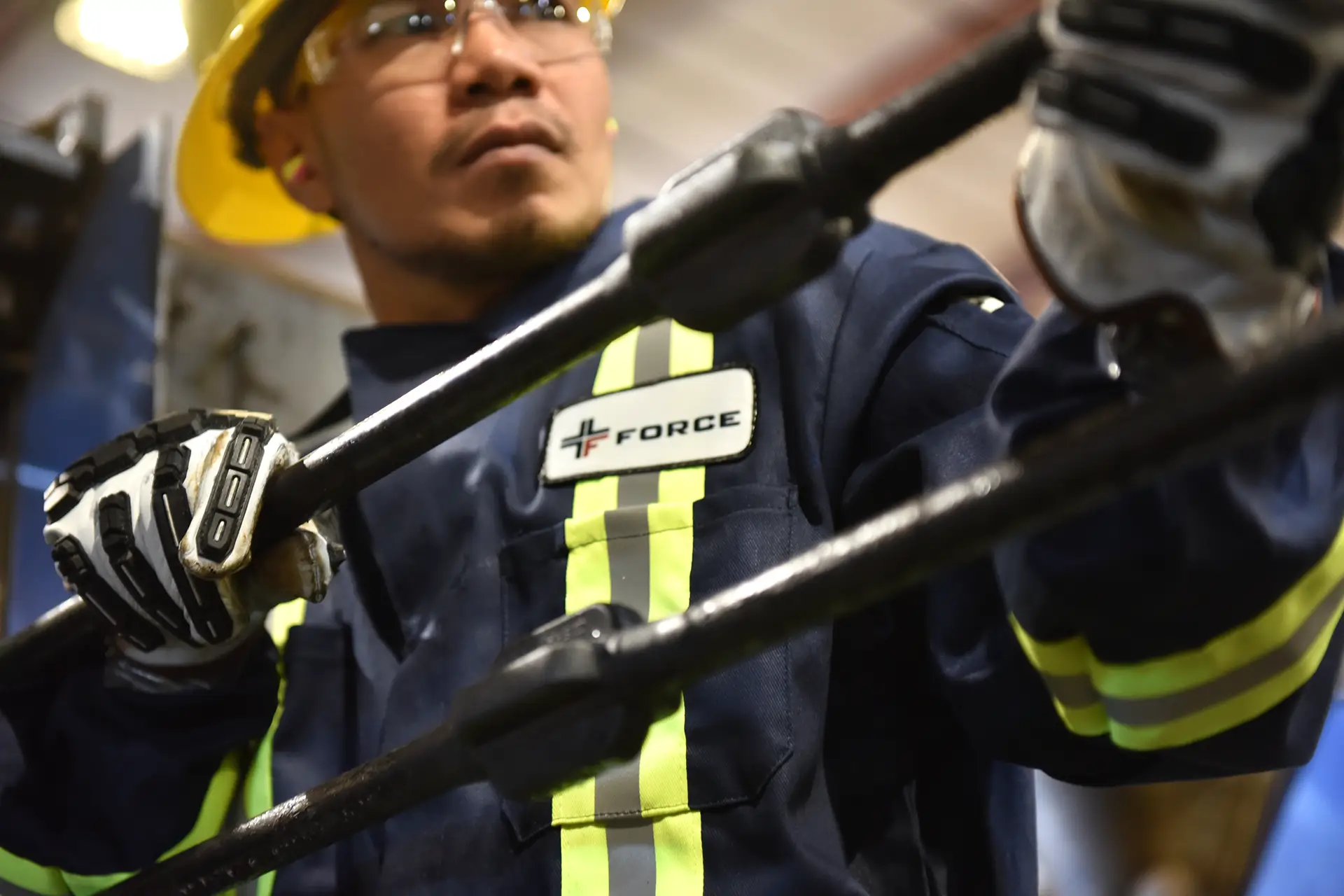Force Inspection Services employee with pipes