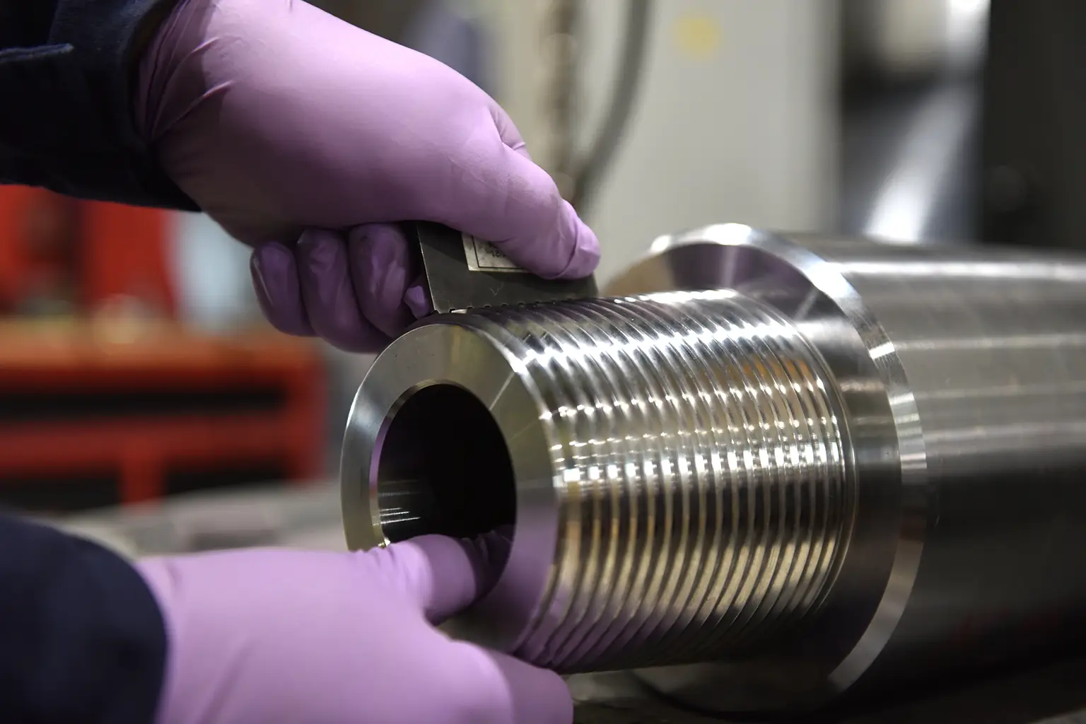 Force Inspection Services Purple gloves working on a pipe