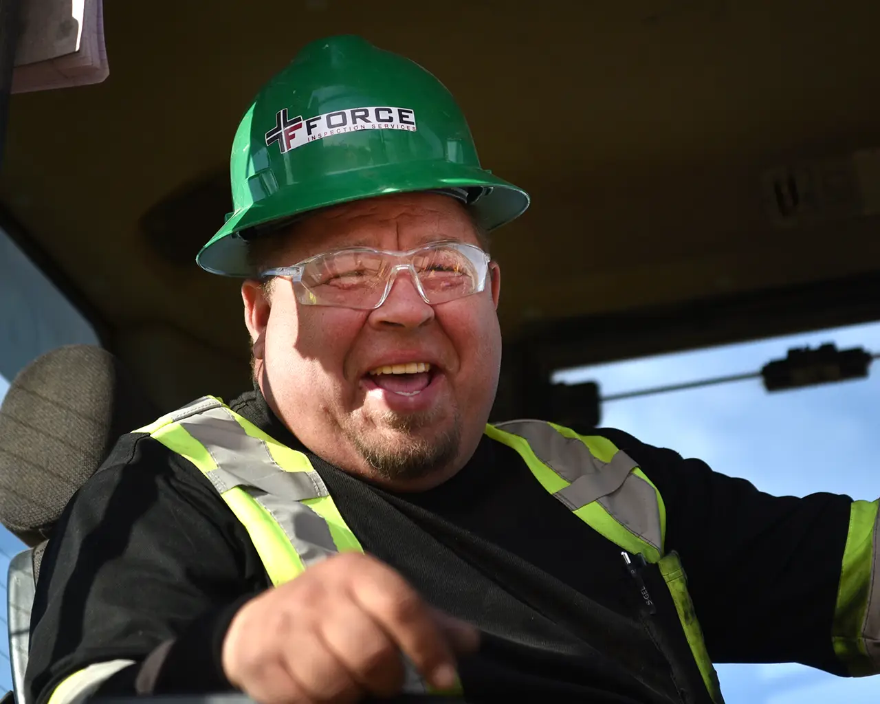 Force Inspection Services QHSE Man in Force Inspection safety gear laughing