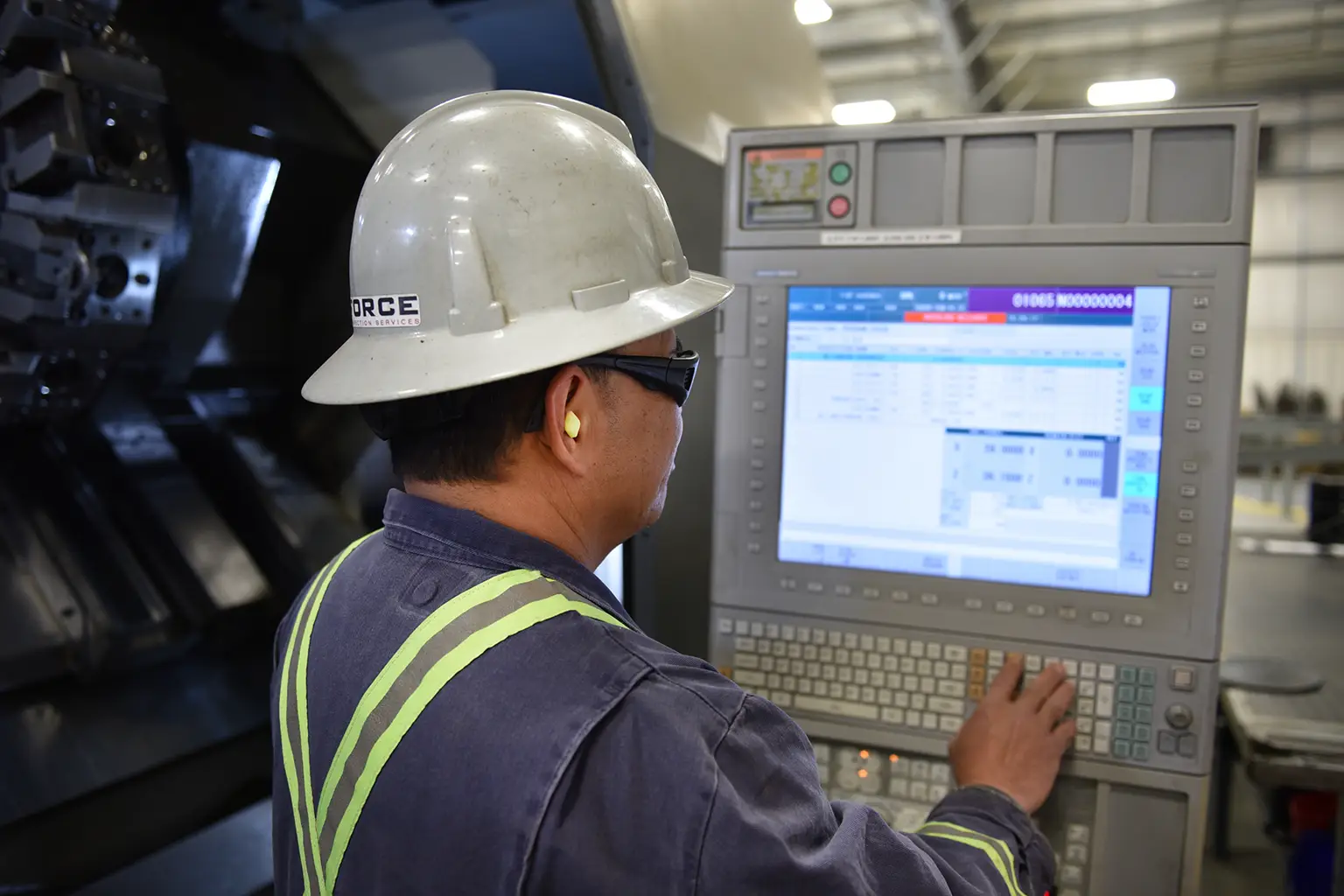 Force Inspection Services threading man working on computer equipment